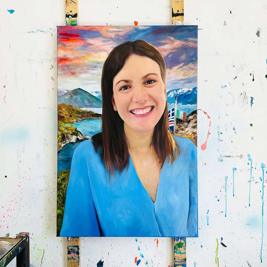 Beautiful portrait of a woman with a painted landscape background, created by Nikolaus Kriese, highlighting his skill in detailed and vivid landscape art for international clients.