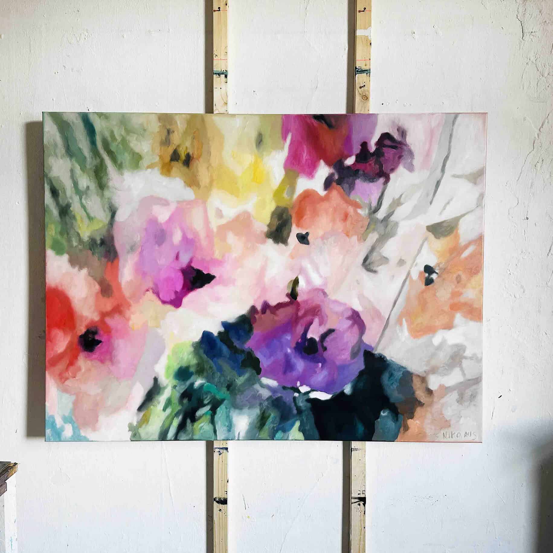 Colorful floral watercolor artwork created by Nikolaus Kriese, showcasing a blend of vivid pinks, purples, greens, and oranges in an abstract floral composition.