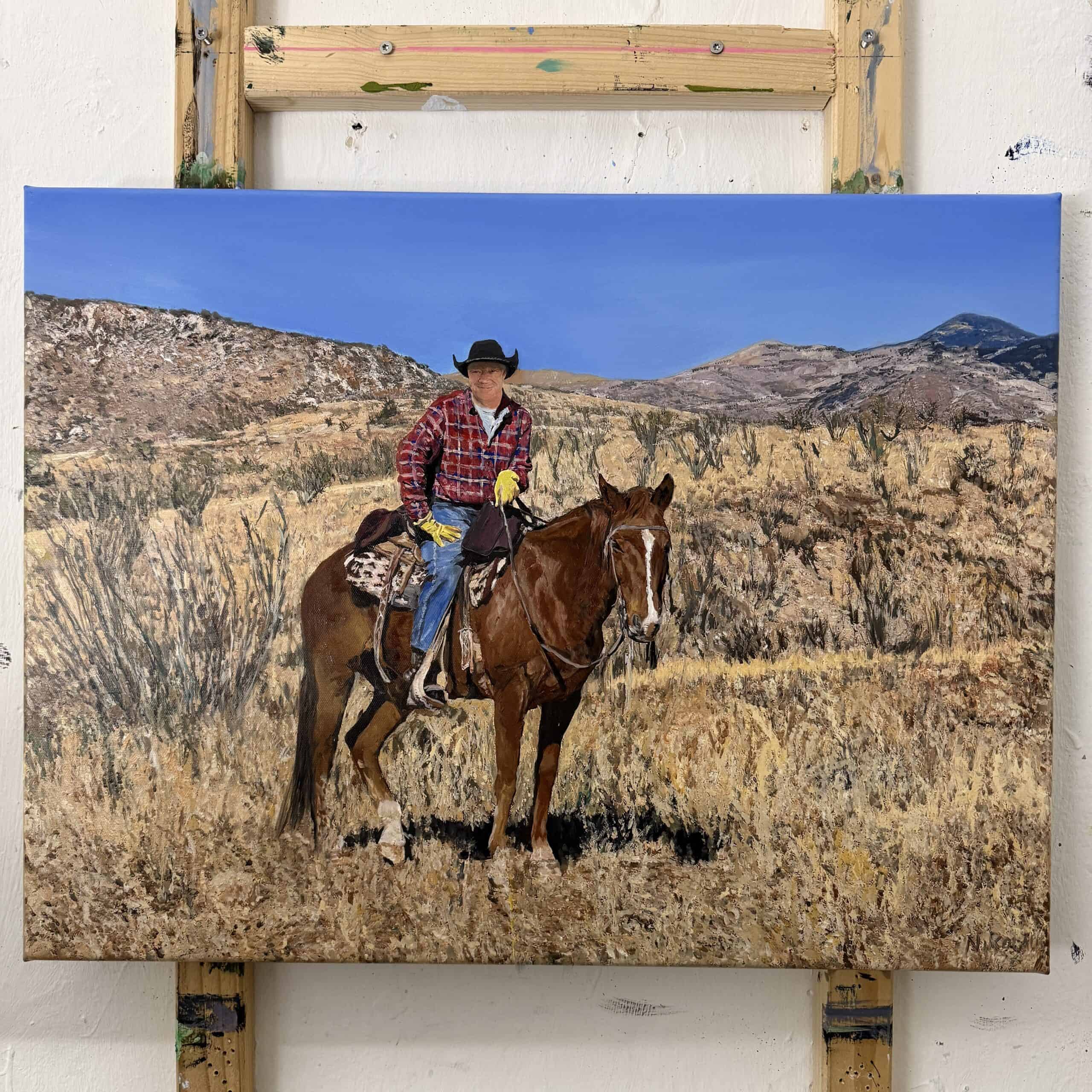 Portrait of a man riding a brown horse in a dry, mountainous landscape under a clear blue sky, showcasing Nikolaus Kriese's detailed painting style.