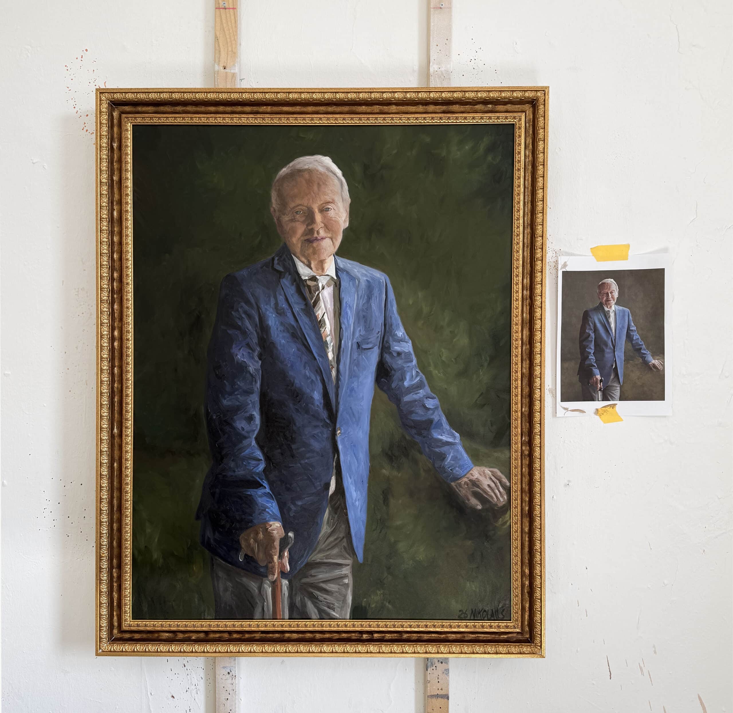 Hand-painted oil portrait on canvas based on a reference photo, framed artwork in artist studio